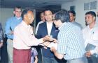 Shri RA Jalan hands over the cheque and congratulates Dr Naresh Goyal of the Rotary Club of Calcutta Metropolitan