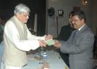 Governor presenting 1 lakh cheque to DG Aniruddh Roy Chowdhury on behalf of Jagriti Art for Polio & Literacy